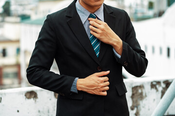 Body of businessman wearing formal business suit. Workplace fashion. uds