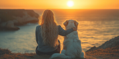 Fototapeta premium Woman hugging dog and enjoying golden sunset at the beach