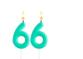 Green birthday candle on white background - Candle number 66