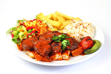 Plate of traditional grilled meatballs on white background