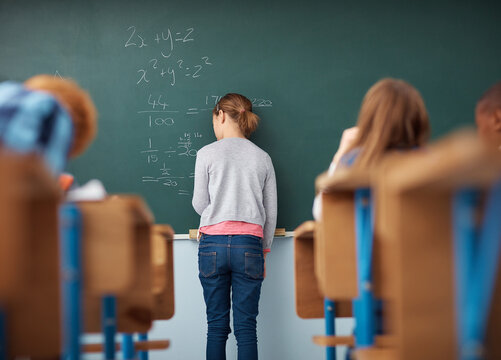 School, classroom and back of girl by chalkboard for math quiz, test and assessment in lesson. Education, student and worried child with equation for problem solving, solution and learning at academy