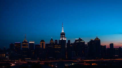 Naklejka premium Glowing outline of a city skyline at dusk, capturing the transition from day to night, city glowtime, urban and dynamic.