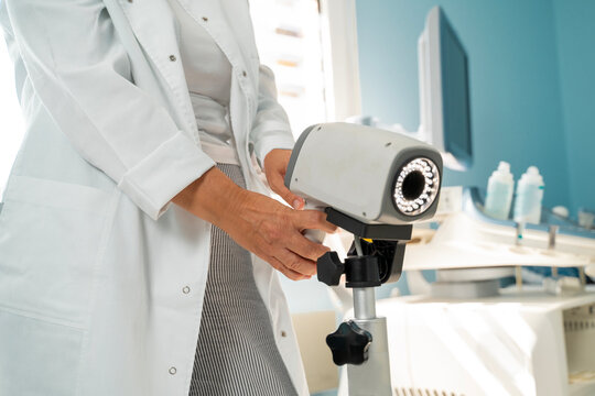 Closeup shot of unrecognizable doctor with colposcopy apparatus  