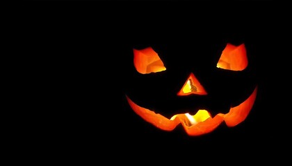 Fototapeta premium Carved Halloween pumpkin glowing in dark. Halloween Jack o Lantern pumpkin, celebration concept, day of the dead, Halloween and decoration, banner, poster, flyer, created with generative ai