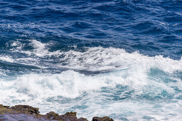 Dramatic Ocean crashing wave Hawaii at Makapu Point
