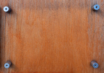 Timber veneer background with metal studs