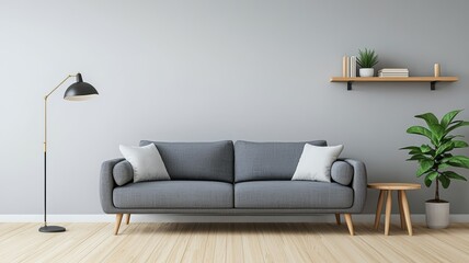 A living room with a grey couch and a potted plant