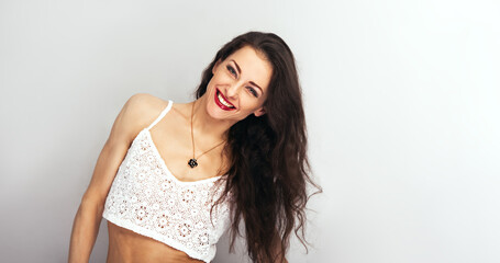 Beautiful bright makeup perfect face woman with red lipstick looking with happy toothy smiling on...