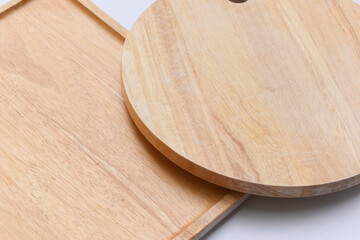 brown wooden tray and sphere cuttingboard isolated on white background