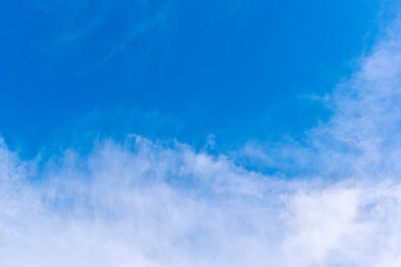 beautiful blue sky and white fluffy group of clouds with sunrise in the morning, natural background