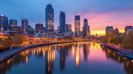 Fototapeta premium Cityscape with River Reflection at Sunset