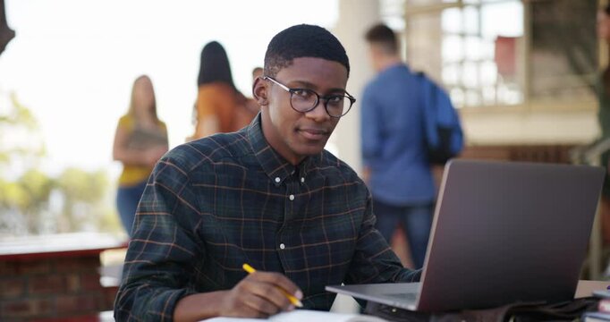 Happy man, student and learning on a laptop, planning and notes for studying, knowledge and education on campus. Face of young African person with book and computer for school, college or university