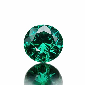 Round-cut green emerald gemstone with reflection
