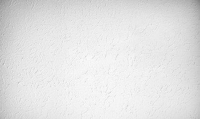 White textured wall or ceiling with plaster painted. Flat light texture with circular pattern and artistic impression.