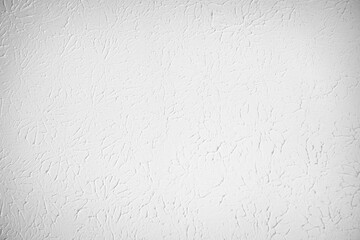 White textured wall or ceiling with plaster painted. Flat light texture with circular pattern and artistic impression.