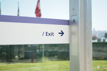 Signage Clearly Indicating the Exit Direction at a Specific Urban Location for Navigation and Safety