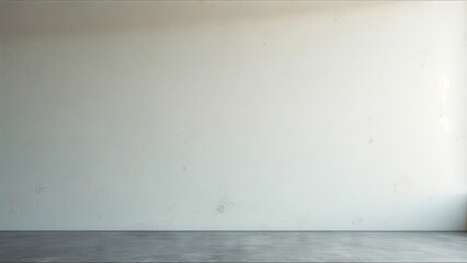 A large empty room with a white wall