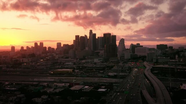 Aerial of Downtown Los Angeles Skyline Sunset over Highway 101 During Rush Hour 3
