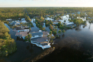 Consequences of natural disaster. Heavy flood with high water surrounding residential houses after...