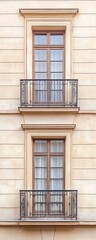 Obraz premium Elegant balcony design featuring two window frames in a classic architectural style against a muted wall.