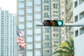 Traffic lights for traffic regulation high above street in Miami, Florida