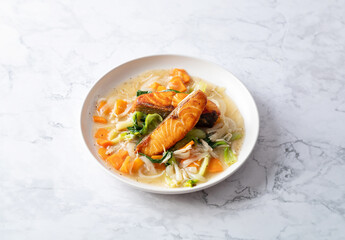 Salmon steak with vegetables on a plate	