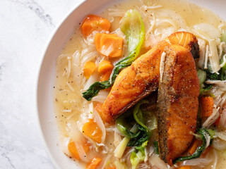 Salmon steak with vegetables on a plate