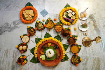 Decorated earthenware in which bengali dishes is served at Baby Shower