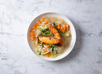 Salmon steak with vegetables on a plate	
