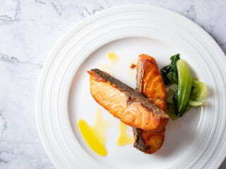 salmon steak on a plate	