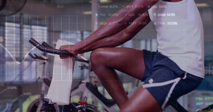 Animation of financial data processing over african ameican man exercising in gym