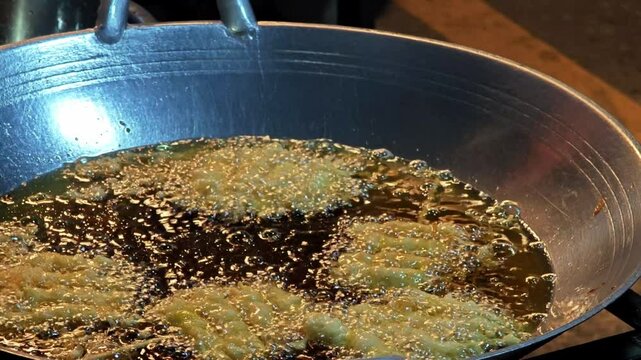 Deep fried food in hot oil.