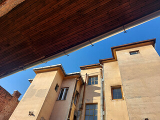 Architectural detail, of old urban building wall against blue sky