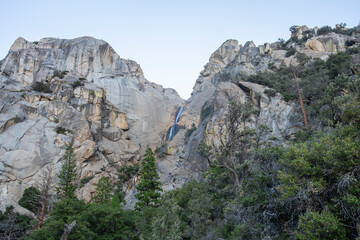 Beautiful mountain waterfall between two rock domes