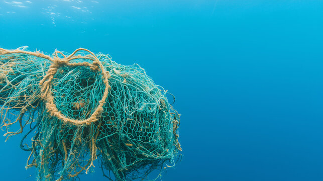 wad of discarded fishing debris including nets in a clump of trash under the ocean's surface