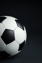 Naklejka premium Detailed black and white soccer ball image