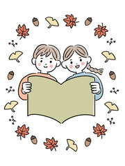 本を広げる子供と秋のモチーフ