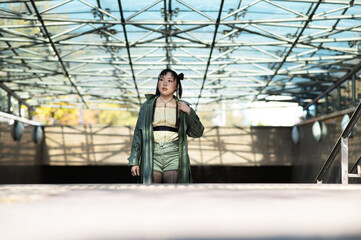 Fototapeta premium Young Asian woman climbs stairs from the subway. 