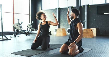 Fitness, high five and success with friends in gym for challenge, sports training or workout. Done, floor and support with smile of athlete people in health club for exercise goals or target
