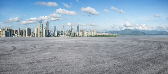 Asphalt road square with city skyline in Shenzhen. panoramic view. car advertising background.