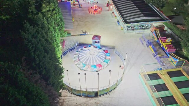 Nighttime view a carnival with rides and.