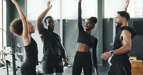 People, fitness and celebration in gym, support and motivation with endurance, challenge and victory. Group, men and women in wellness center, winning and happiness with workout, cheering and healthy