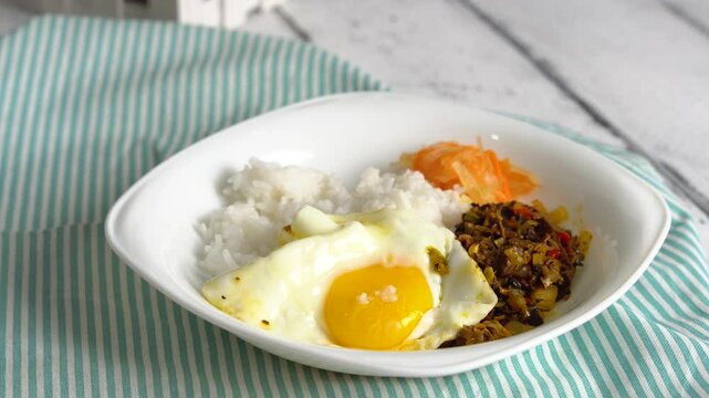 Filipino dish of pork or beef lungs and heart saut&eacute;ed in tomatoes, chilies and onions also known as Bopis