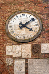 Fototapeta premium Buonconvento, Siena Italy - August 24, 2024: Civic Tower Clock