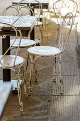 San Quirico D'Orcia, Siena Italy - August 25, 2024: tables and chairs of a bar in a street of the historic center