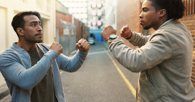 Angry men, city and fight for conflict, violence and disagreement or bullying in alley. Battle, fist and people with problem, argument and aggression with self defense outdoor brawl in street