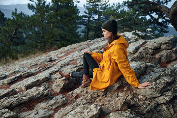 Solitude and Serenity A Woman in a Yellow Raincoat Contemplating Nature in the Mountain Wilderness
