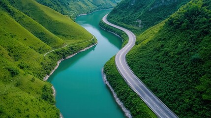 Fototapeta premium Aerial view of a winding river surrounded by lush green hills, showcasing nature's beauty and tranquility.
