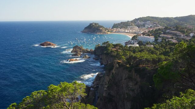 Sea Cliffs And Resort Beach In Tossa de Mar Town, Costa Brava, Catalonia Spain. Aerial Wide Shot