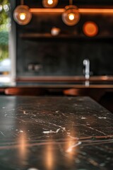 Fototapeta premium A kitchen with a marble countertop and a sink. The countertop is shiny and reflective, and the sink is stainless steel